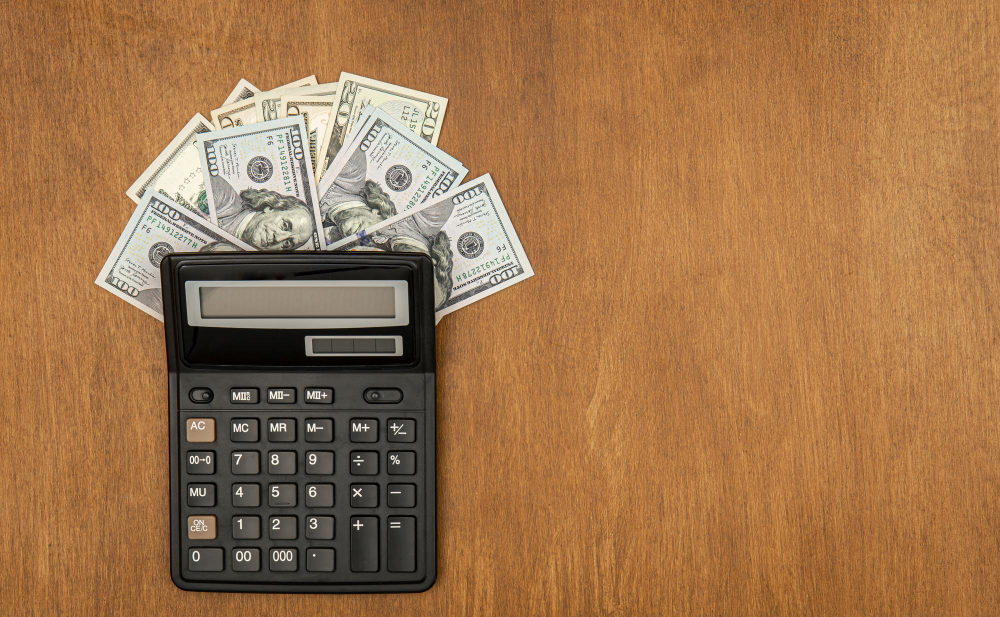 calculator-and-money-on-table